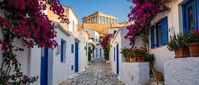 A narrow cobblestone alley in the Anafiotika neighbourhood — whitewashed Cycladic-style houses with blue doors, magenta bougainvillea, and the Parthenon framed at the top of the rise.