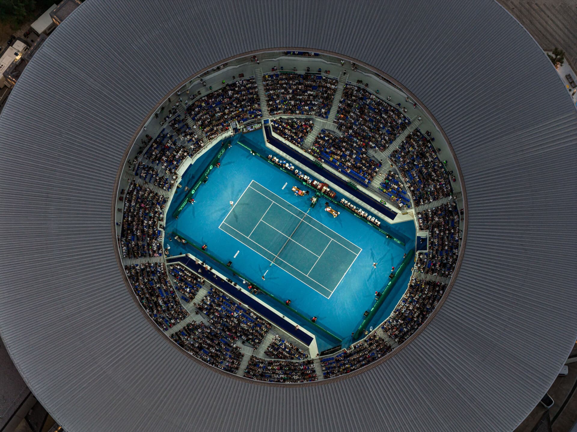 Davis Cup at OAKA, September 2025 — Centre Court overhead, action point during the tie.